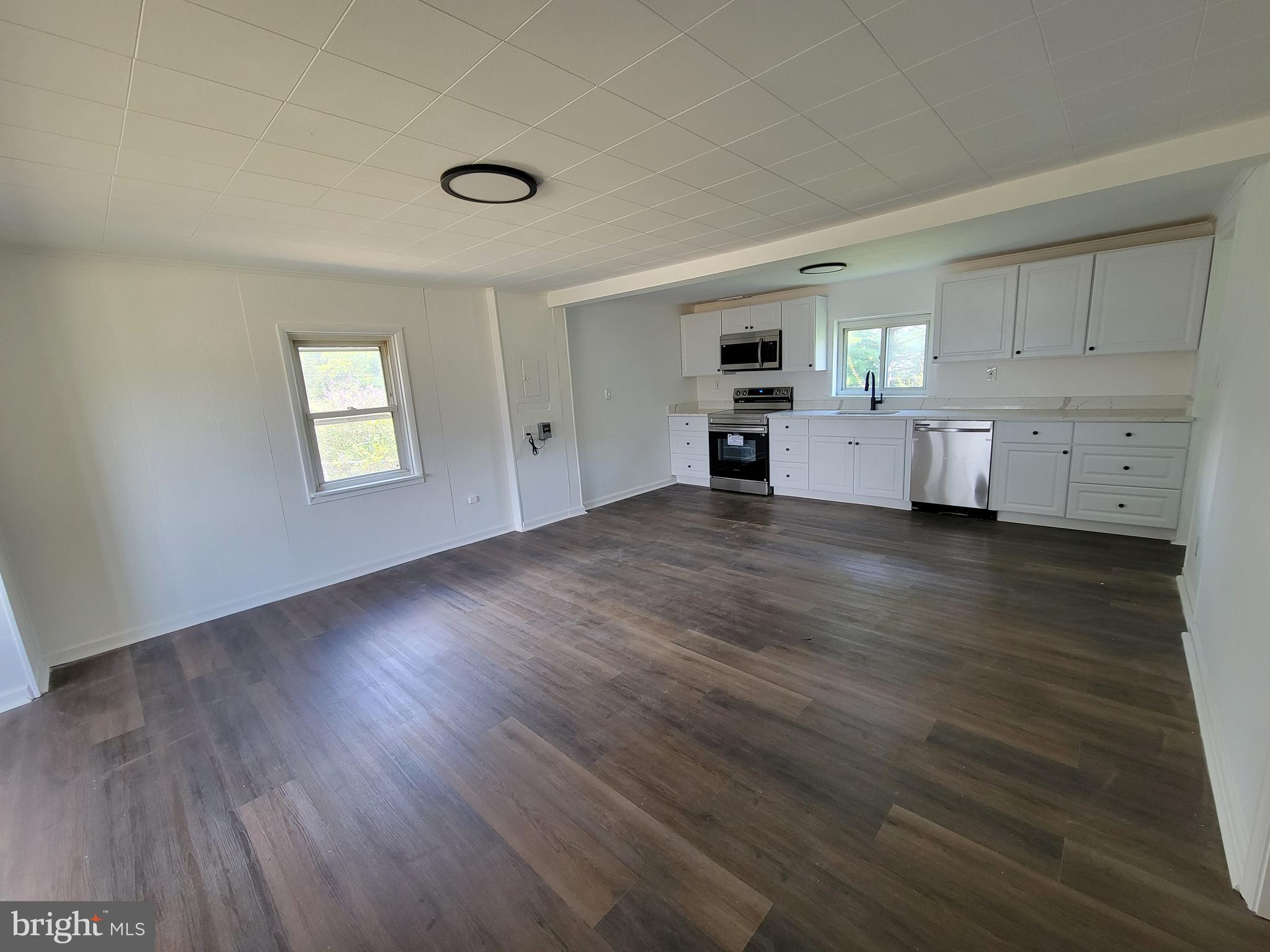 315 Emmert Road Hagerstown, MD 21740 - Photo 4 of 11 a view of empty room with wooden floor and window