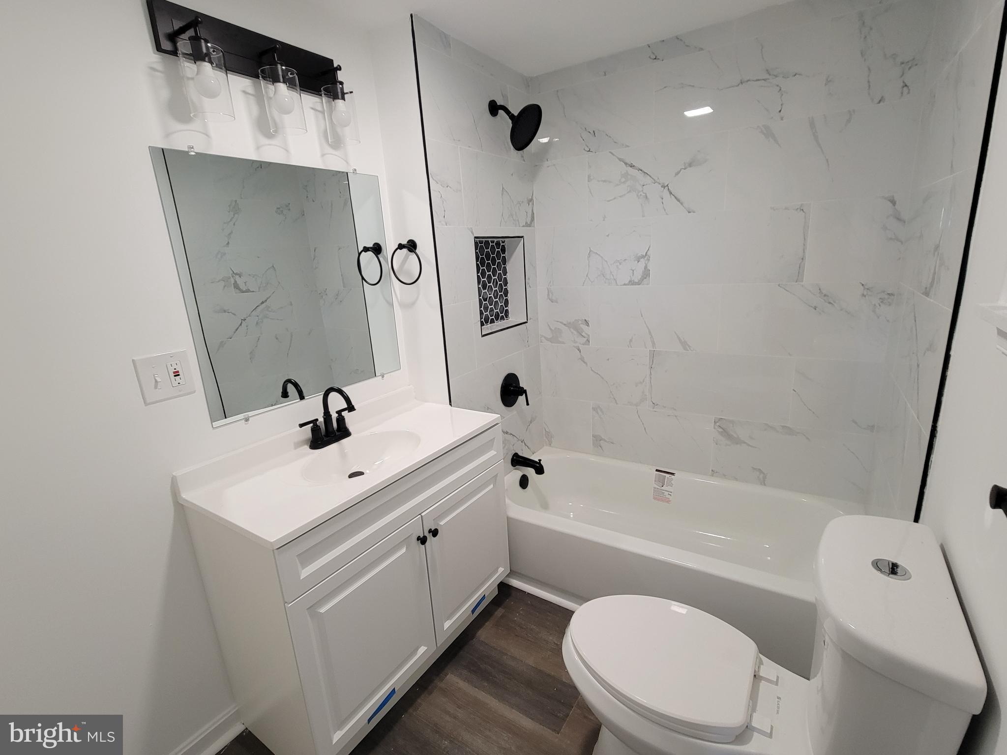 315 Emmert Road Hagerstown, MD 21740 - Photo 9 of 11 a bathroom with a sink a toilet and shower