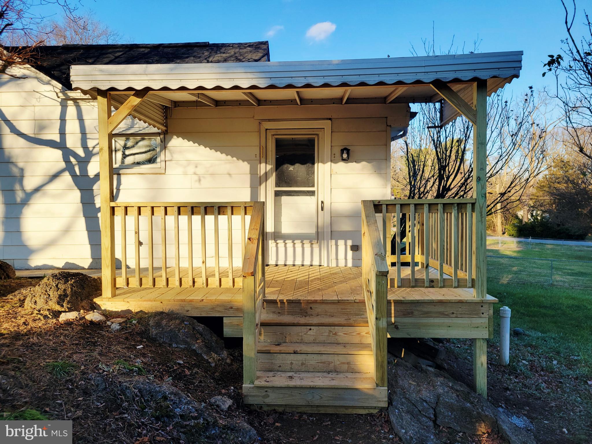 315 Emmert Road Hagerstown, MD 21740 - Photo 10 of 11 a view of a porch with a chair and a yard