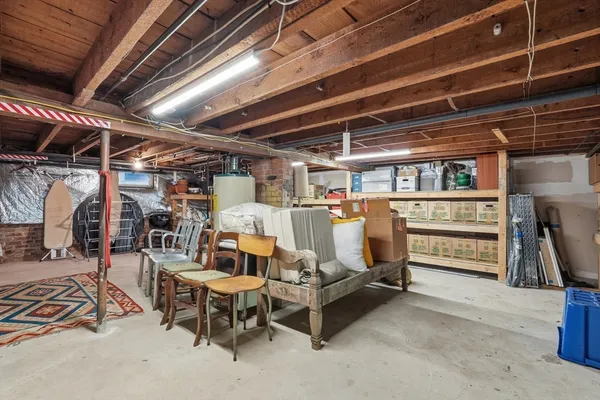 a view of a house with a yard and wooden fence