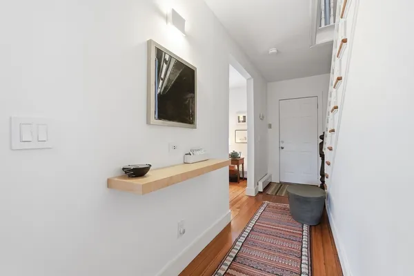 a view of a livingroom with furniture and a flat screen tv