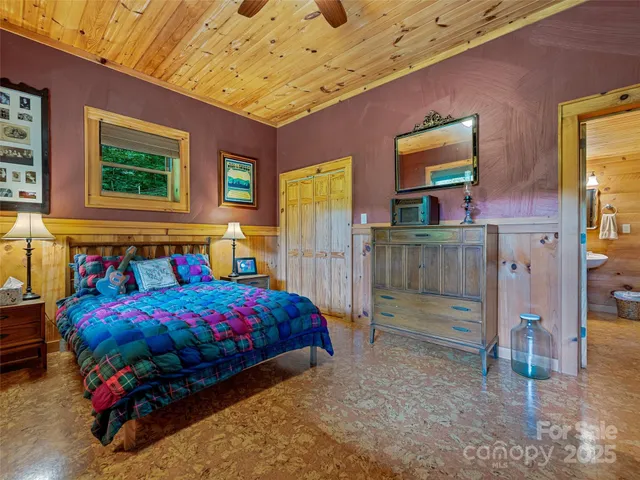 a view of a backyard with furniture and garden