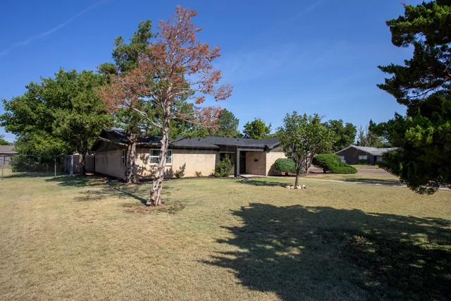 a house with trees in the background