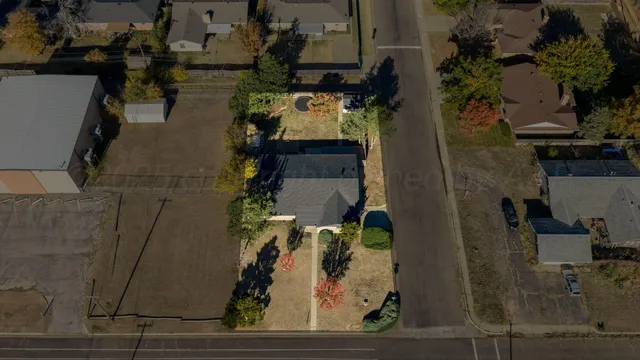 an aerial view of residential houses with outdoor space