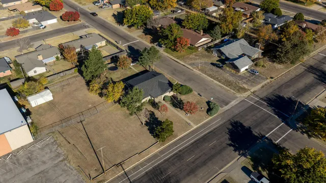 an aerial view of a residential apartment building with a yard
