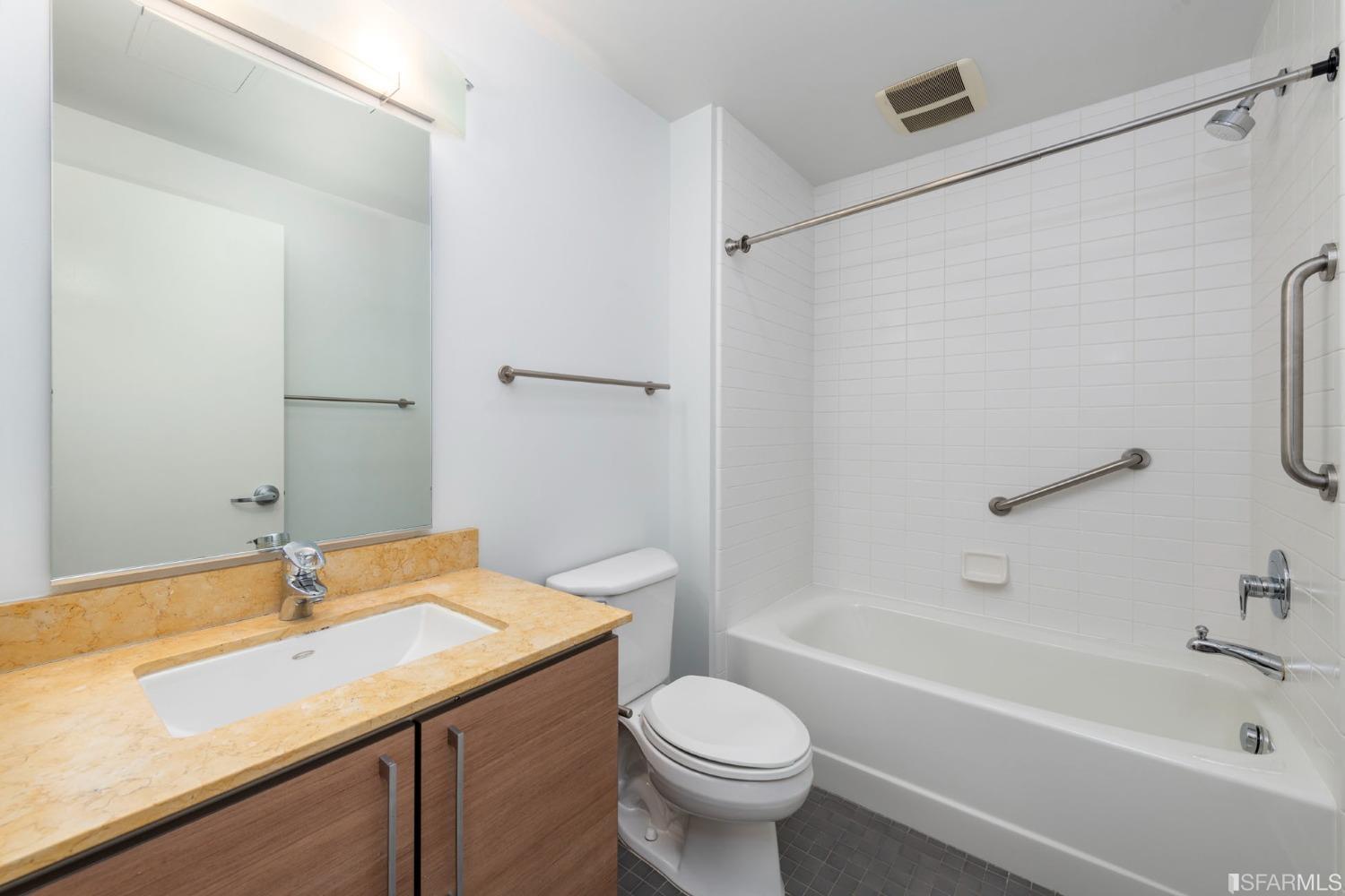 200 2nd Street, Unit 514 Oakland, CA 94607 - Photo 14 of 26 a bathroom with a sink a toilet and a bathtub