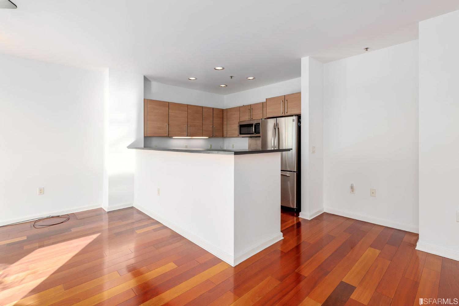 200 2nd Street, Unit 514 Oakland, CA 94607 - Photo 17 of 26 a view of a kitchen with wooden floor