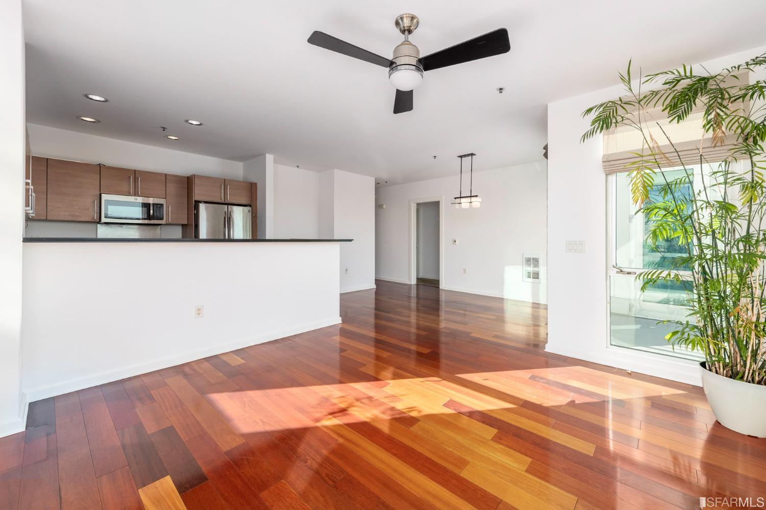 200 2nd Street, Unit 514 Oakland, CA 94607 - Photo 2 of 26 a an empty room with wooden floor and windows