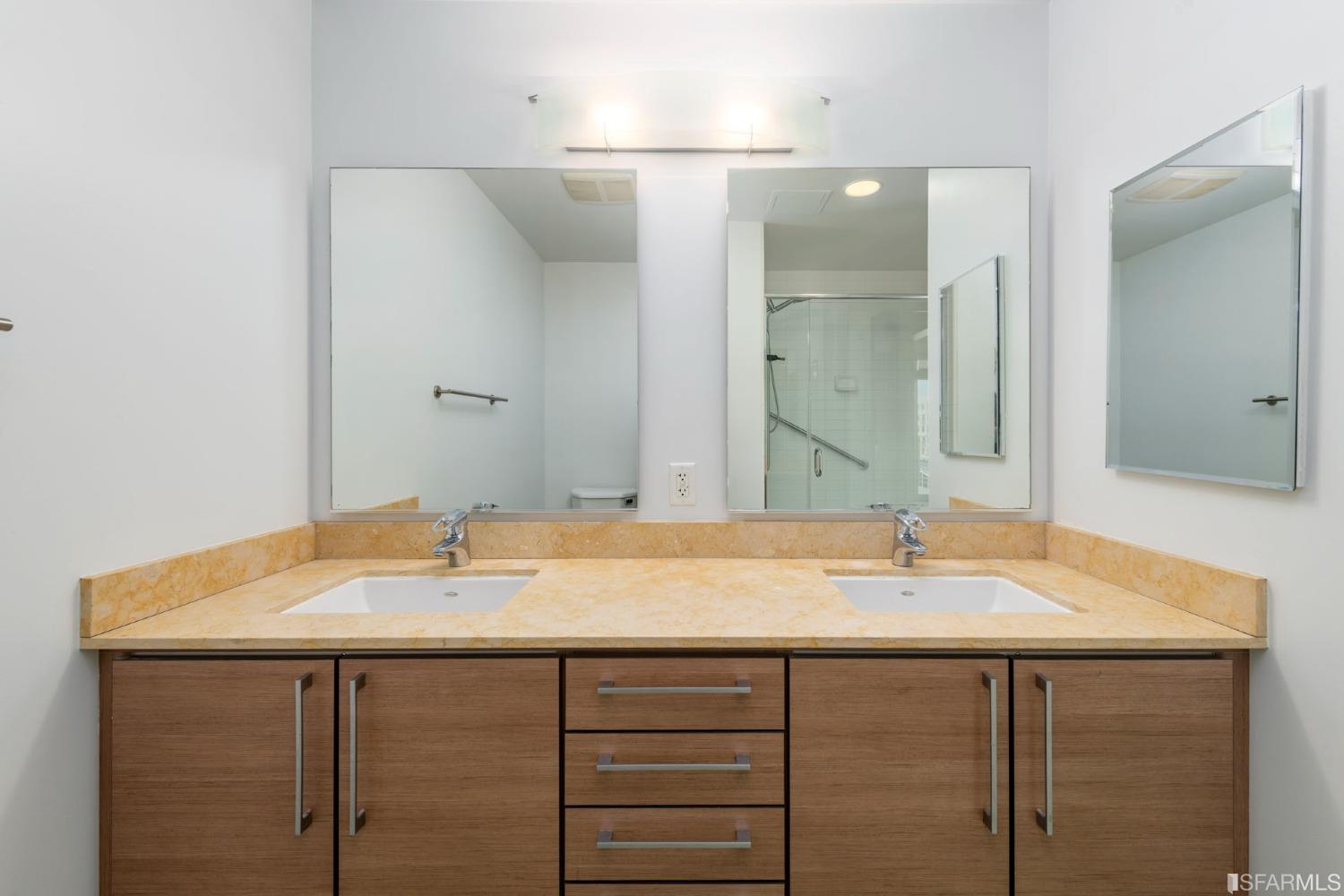 200 2nd Street, Unit 514 Oakland, CA 94607 - Photo 3 of 26 a bathroom with a sink and a mirror