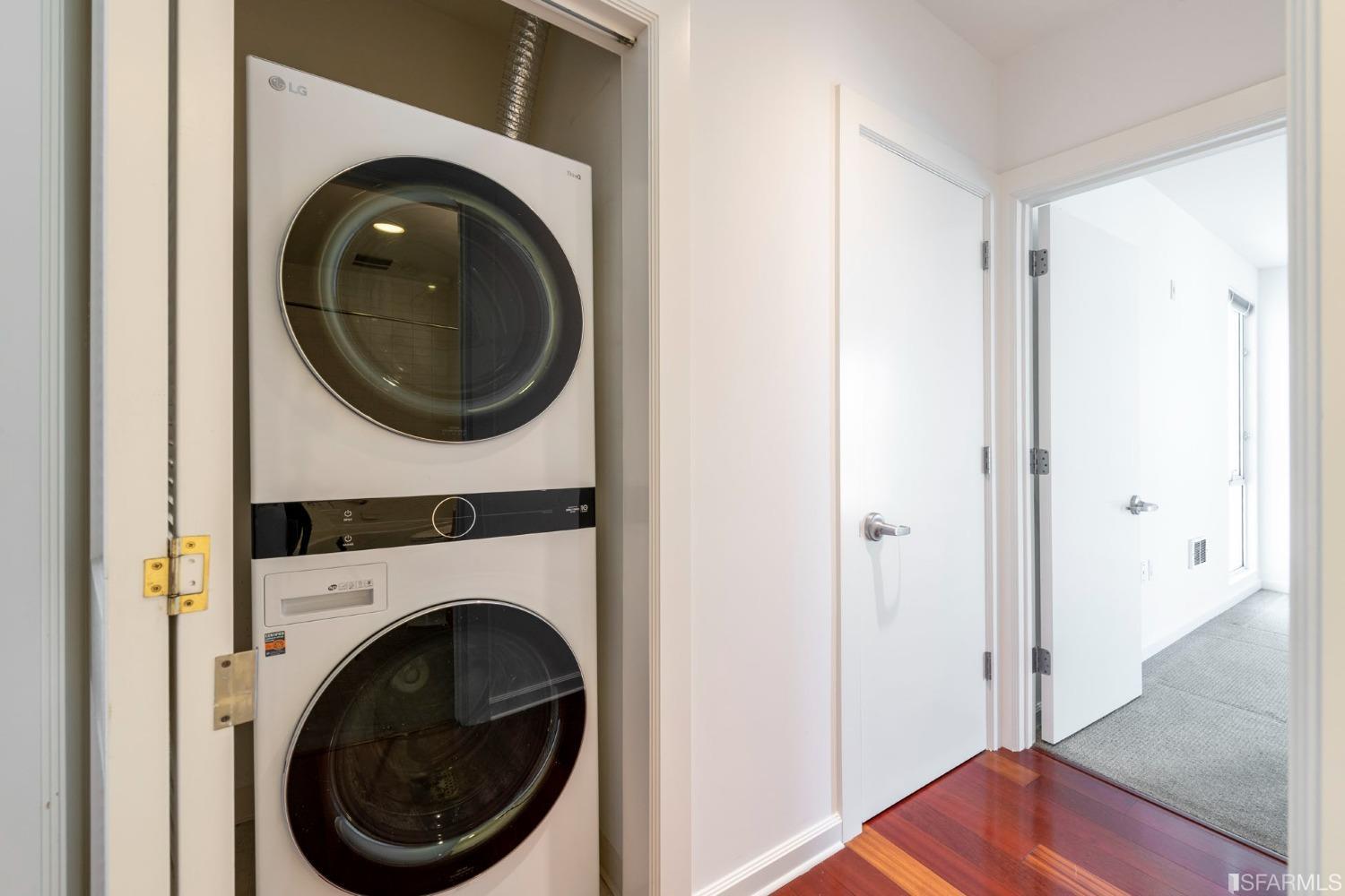 200 2nd Street, Unit 514 Oakland, CA 94607 - Photo 7 of 26 a view of a hallway with washer and dryer