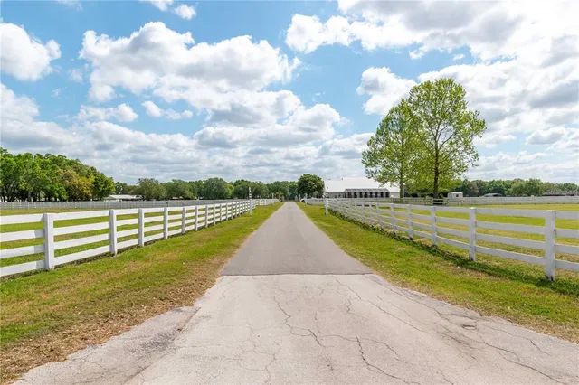 a bathroom with a sink a mirror and a shower