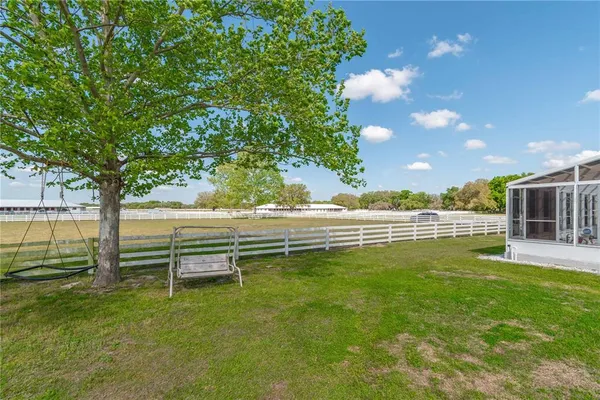 a kitchen with appliances a sink and cabinets