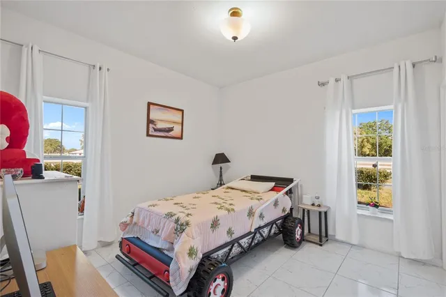 a view of a kitchen with a dining table chairs and iron floor