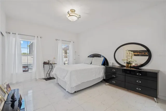 an aerial view of a residential houses with outdoor space