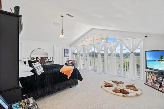 an aerial view of a house with a lake view