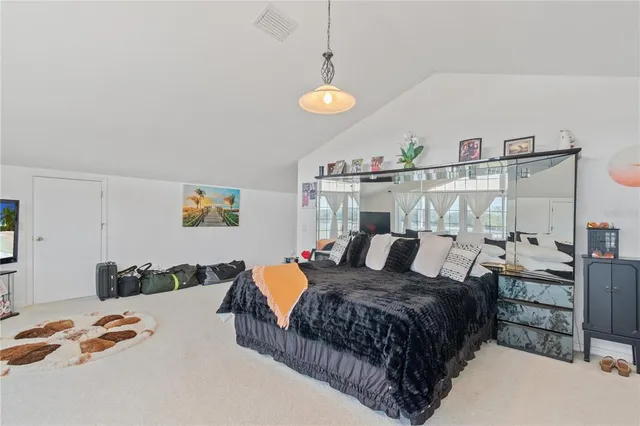 a front view of a house with swimming pool having outdoor seating