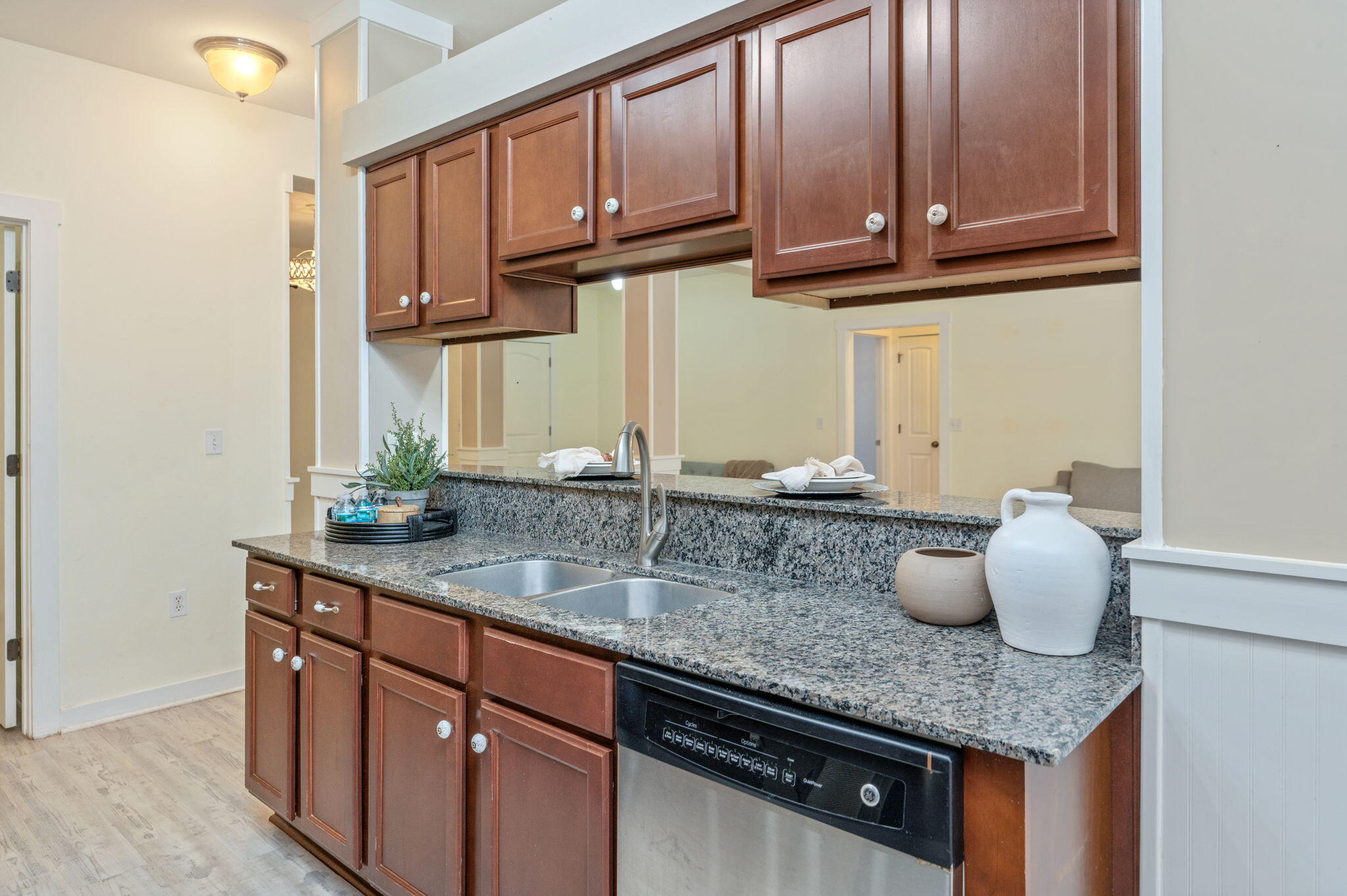 318 Key Lime Place Crestview, FL 32536 - Photo 11 of 30 a kitchen with granite countertop a sink a stove and cabinets