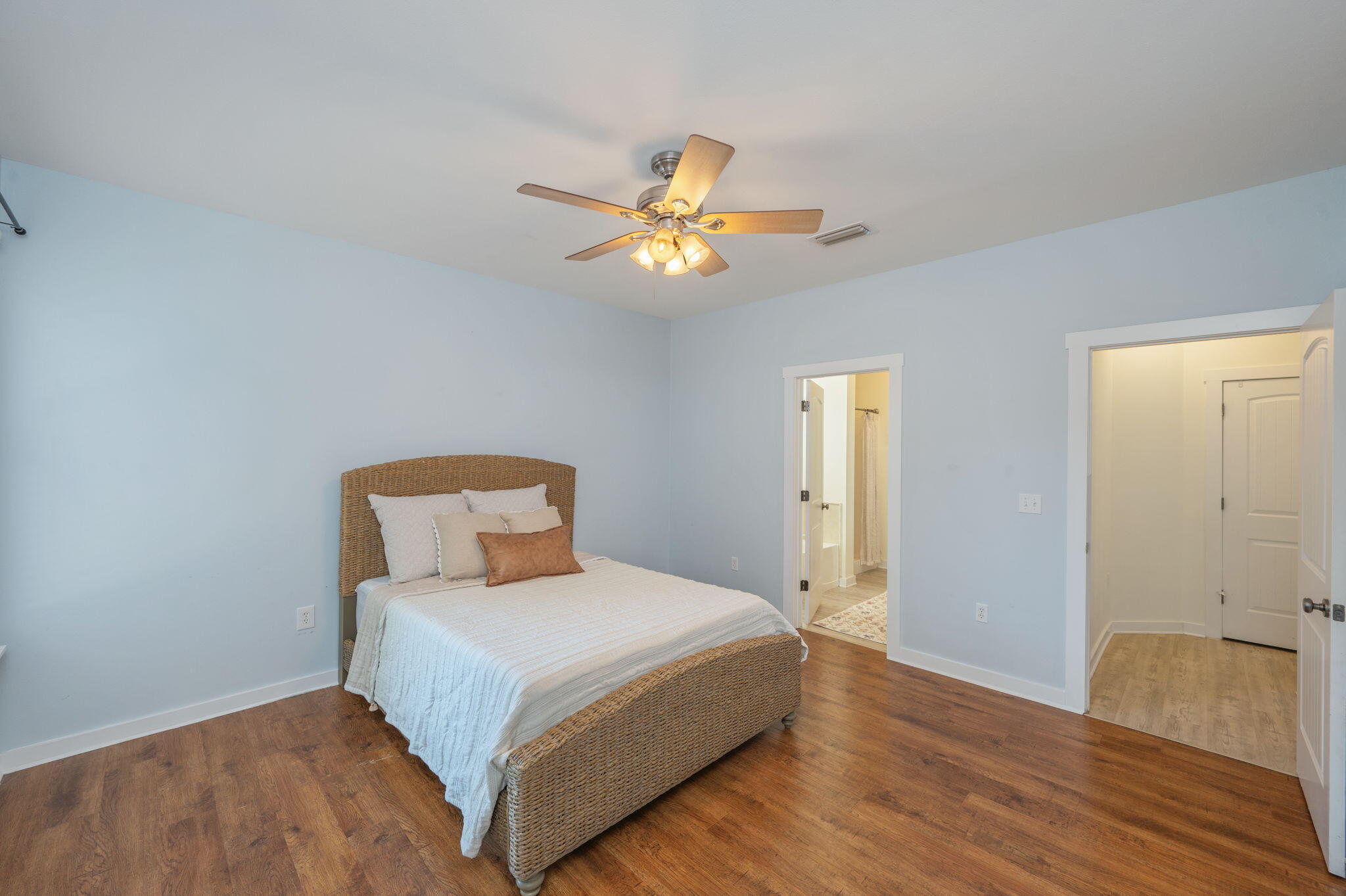 318 Key Lime Place Crestview, FL 32536 - Photo 17 of 30 a bedroom with a bed and a chandelier