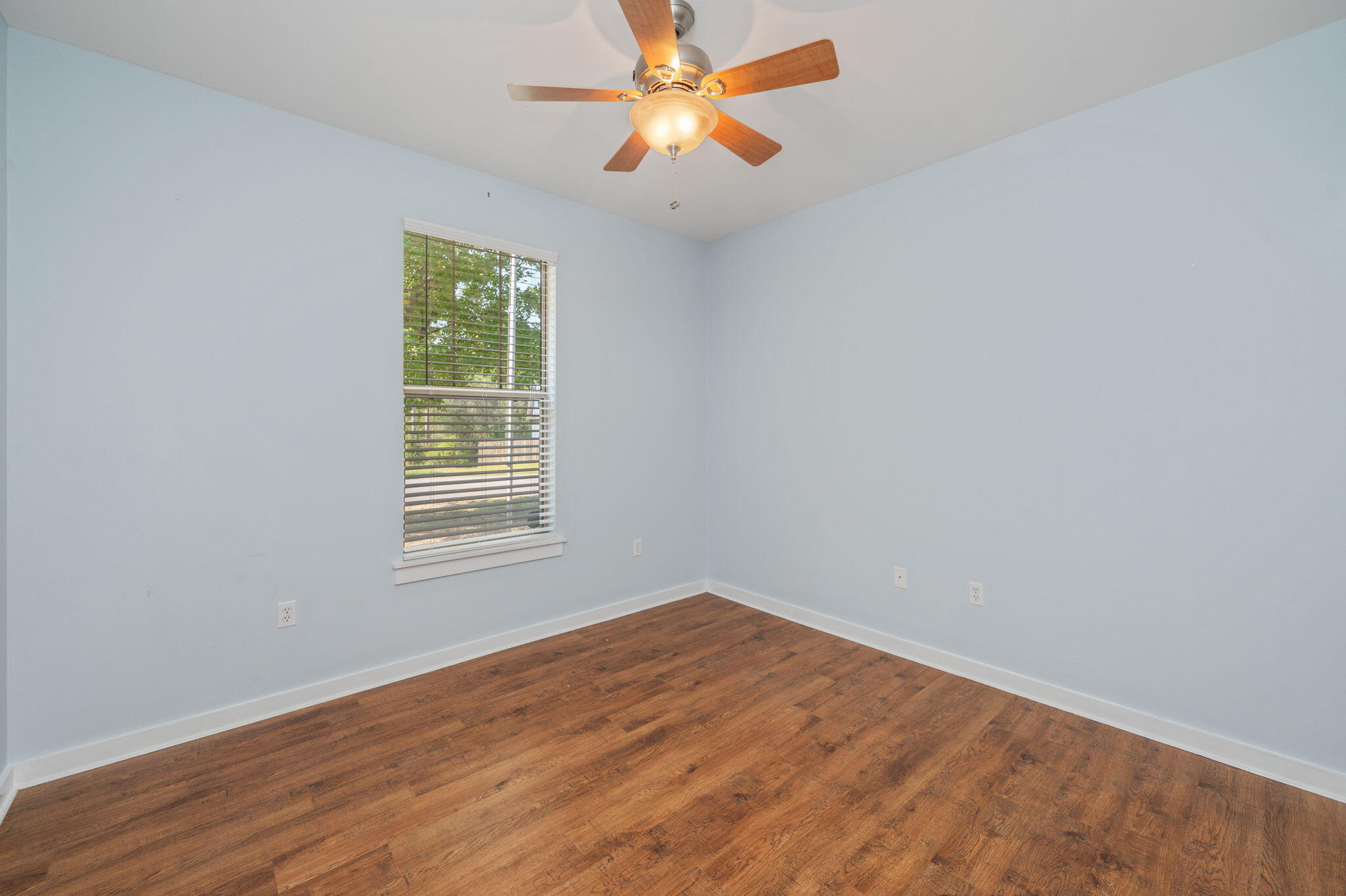 318 Key Lime Place Crestview, FL 32536 - Photo 23 of 30 wooden floor in an empty room with a window