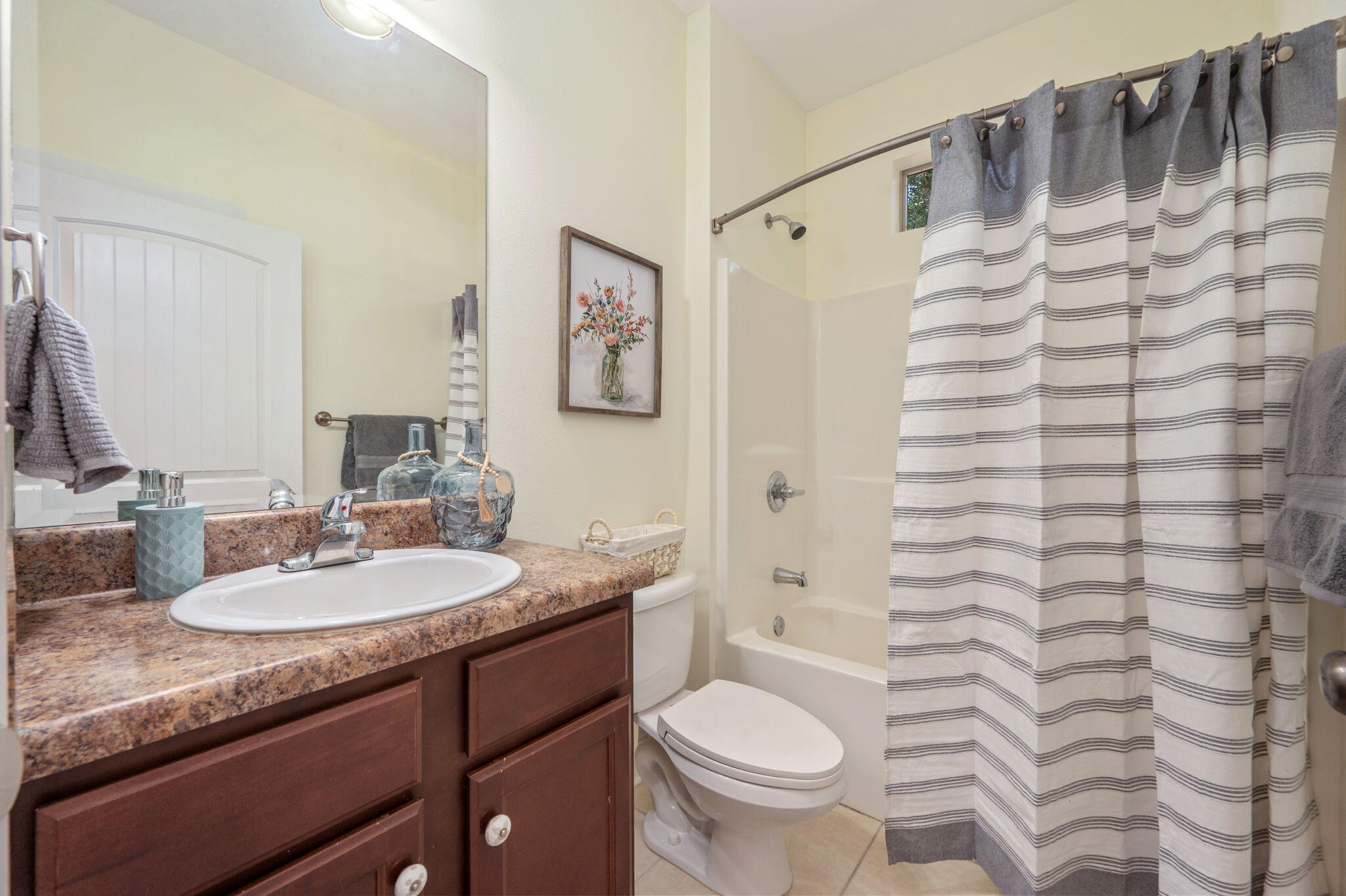 318 Key Lime Place Crestview, FL 32536 - Photo 25 of 30 a bathroom with a granite countertop sink toilet and shower