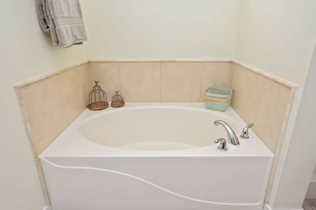 a bathroom with a white bath tub