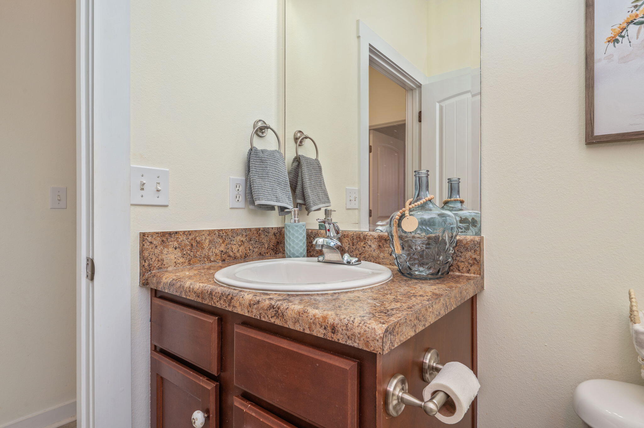 318 Key Lime Place Crestview, FL 32536 - Photo 26 of 30 a bathroom with a granite countertop sink and a mirror