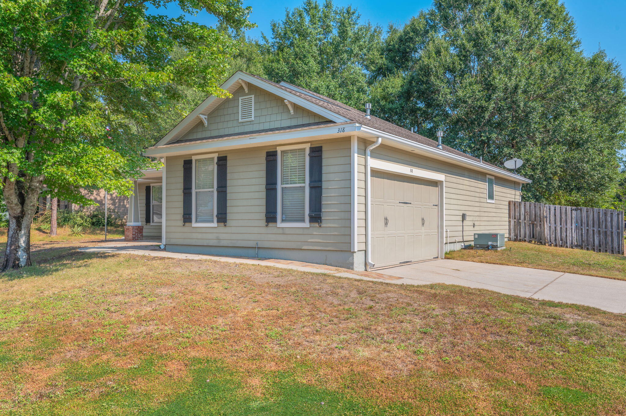 318 Key Lime Place Crestview, FL 32536 - Photo 3 of 30 a front view of a house with a yard and garage