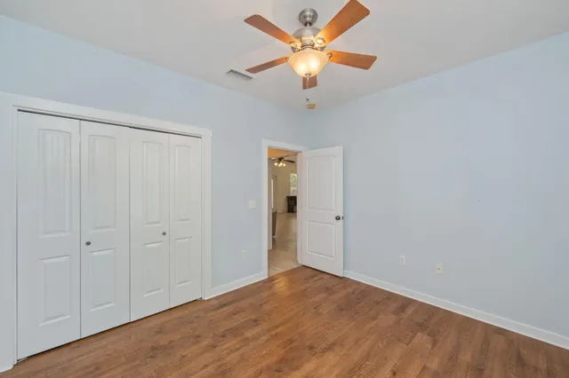 a view of an empty room with a fan
