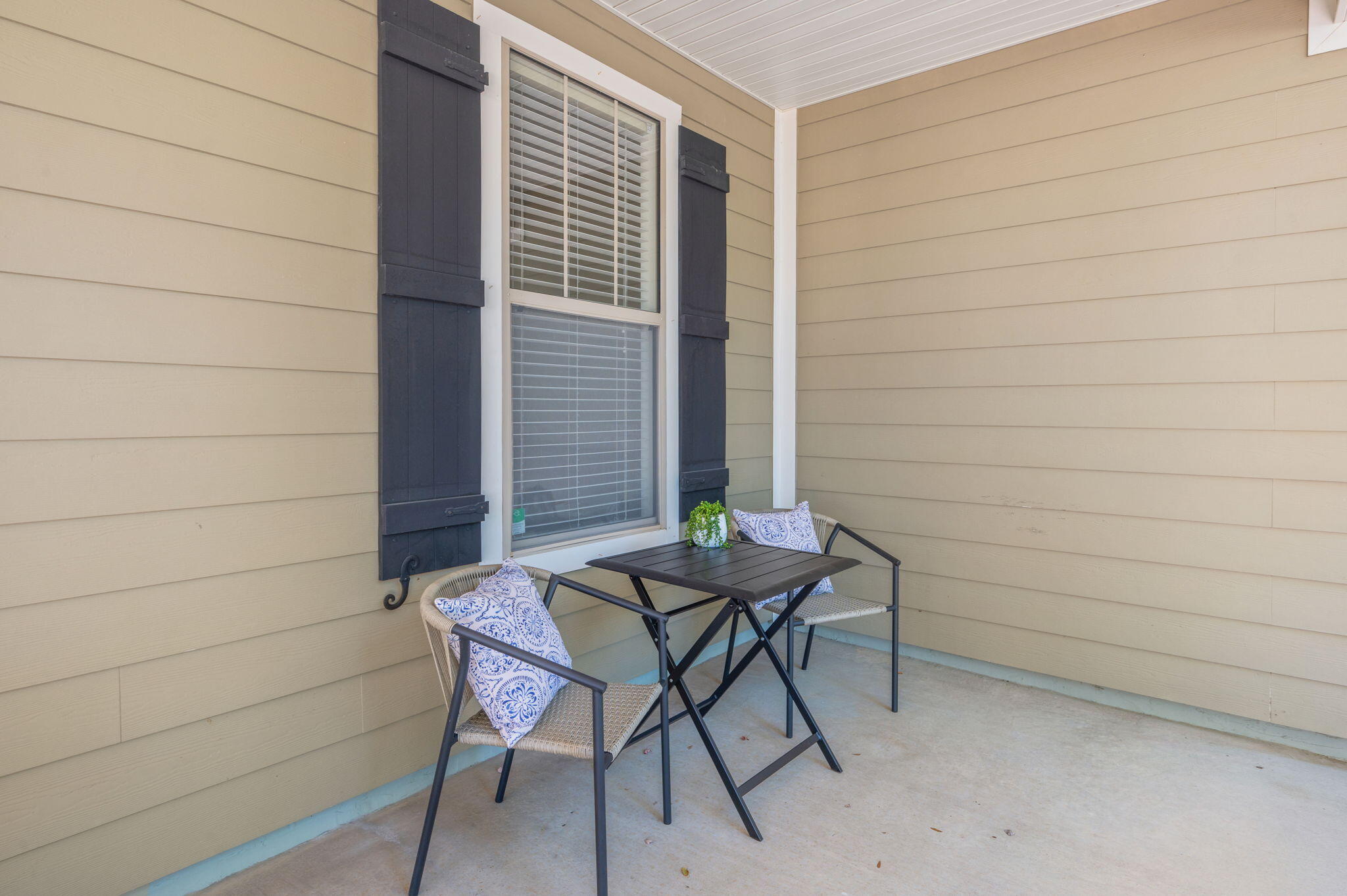 318 Key Lime Place Crestview, FL 32536 - Photo 4 of 30 a balcony with table and chairs