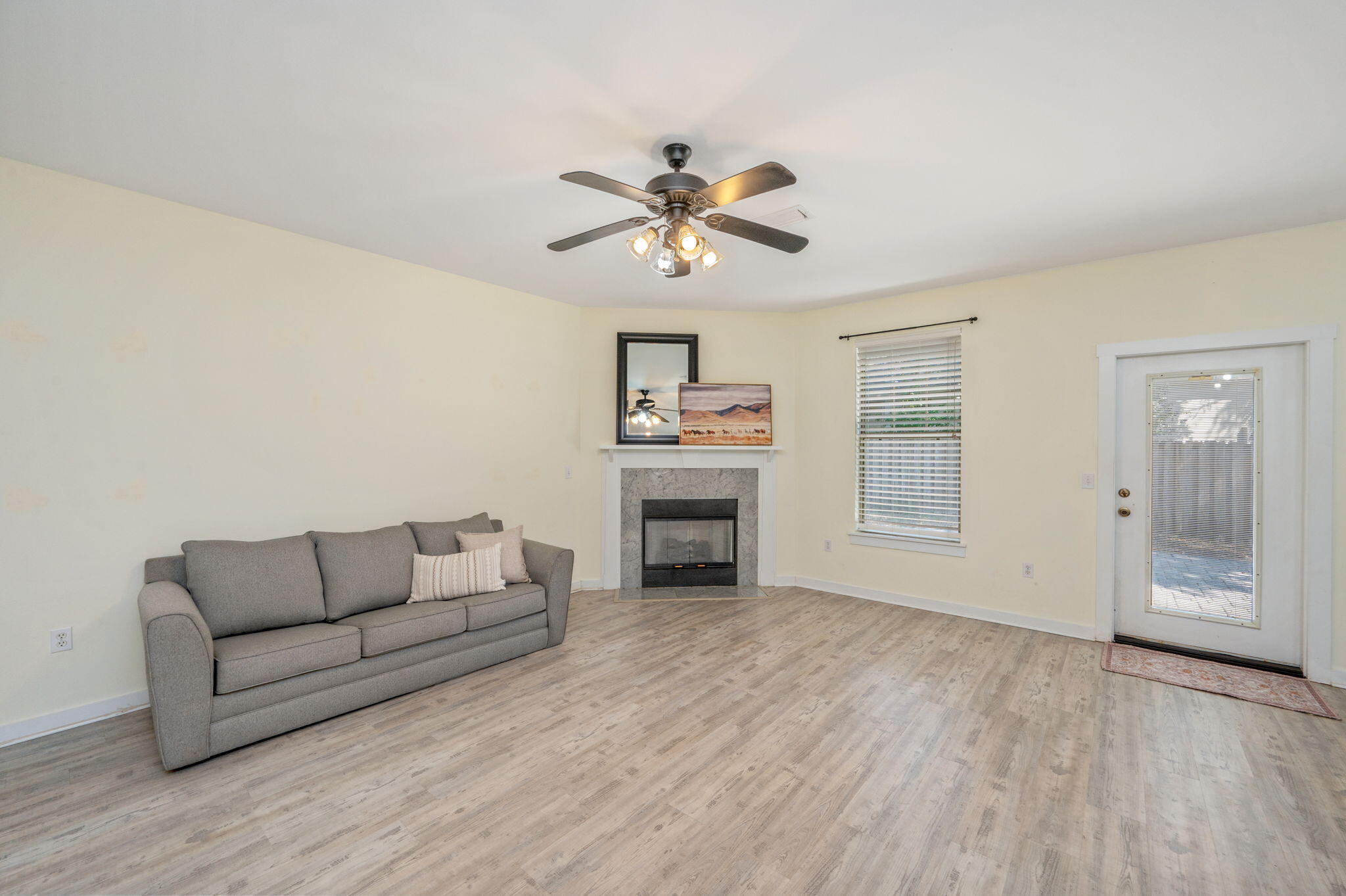 318 Key Lime Place Crestview, FL 32536 - Photo 6 of 30 a living room with furniture and a fireplace