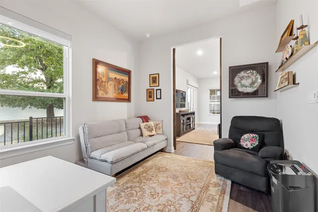 a view of a dining room with furniture wooden floor and chandelier