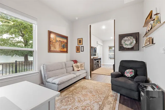 a view of a dining room with furniture wooden floor and chandelier