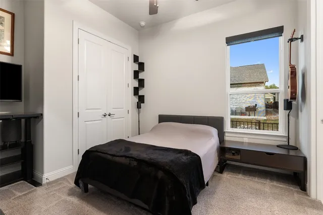 a living room with furniture and a dining table