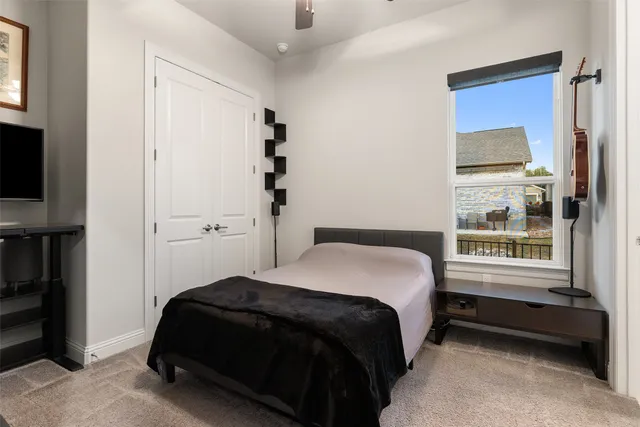 a living room with furniture and a dining table