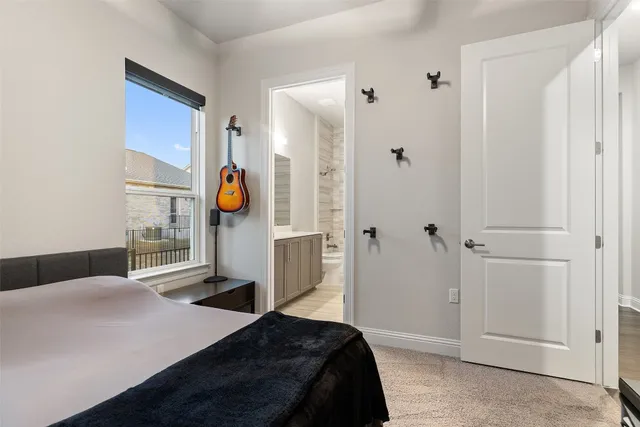 a living room with furniture a rug and a large window