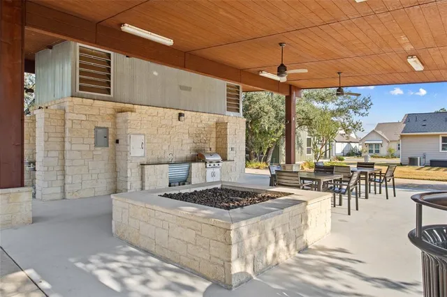 a view of a bedroom with workspace and toys
