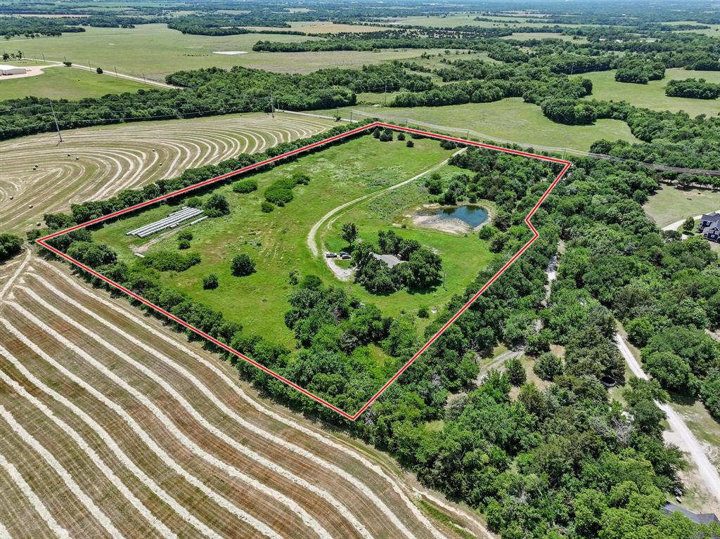 747 Vineyard Road Gunter, TX 75058 - Photo 16 of 32 a view of a yard with an umbrella