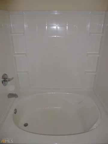 a close up of a bathtub in a bathroom