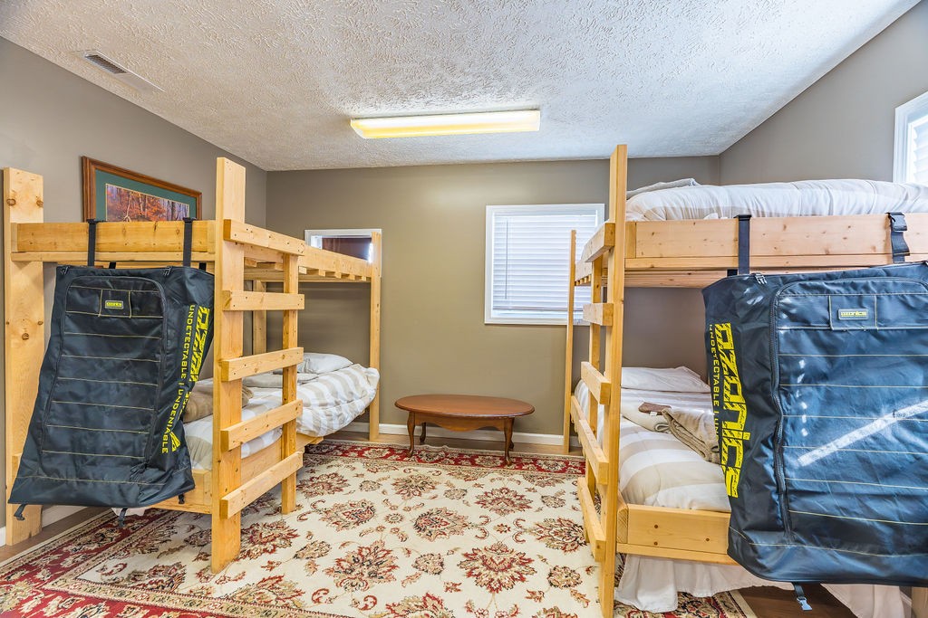 8496 South Madisonville Road Crofton, KY 42217 - Photo 13 of 22 a bedroom with a bed and wooden floor