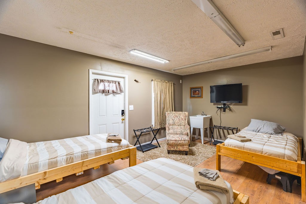 8496 South Madisonville Road Crofton, KY 42217 - Photo 17 of 22 a living room with furniture and a flat screen tv