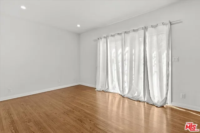a spacious bathroom with a shower and a toilet