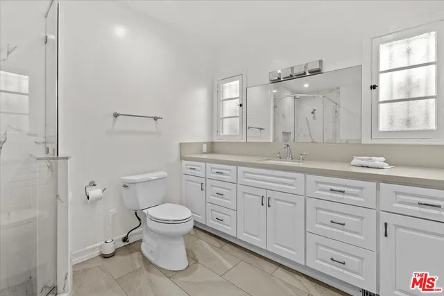 a vase of flowers sitting in front of a window