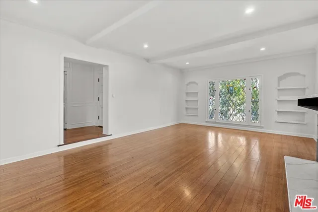 a kitchen with stainless steel appliances a refrigerator sink and stove