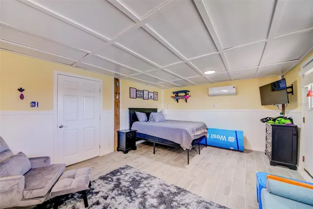 a spacious bedroom with a bed and furniture