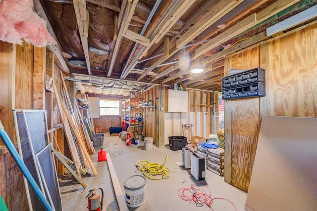 a view of a lake with boats and trees in the background