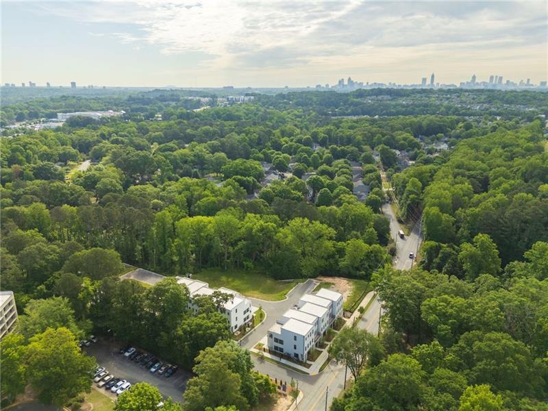 an aerial view of residential house with green space