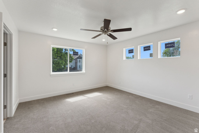 1617 North Angel Street Layton, UT 84041 - Photo 26 of 43 Empty room with light carpet, ceiling fan, and recessed lighting