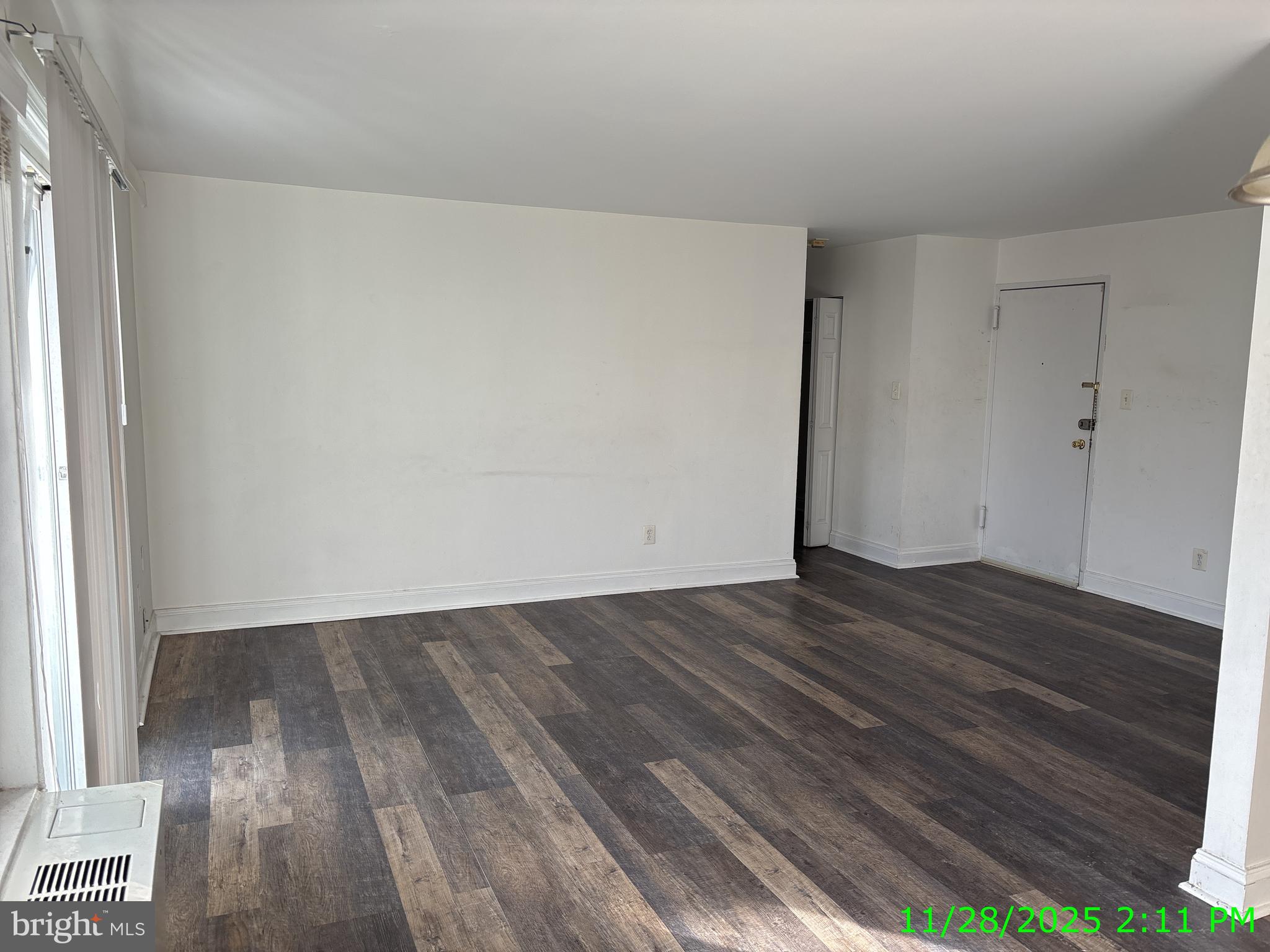 1005 Chillum Road, Unit 319 Hyattsville, MD 20782 - Photo 2 of 5 a view of an empty room and wooden floor