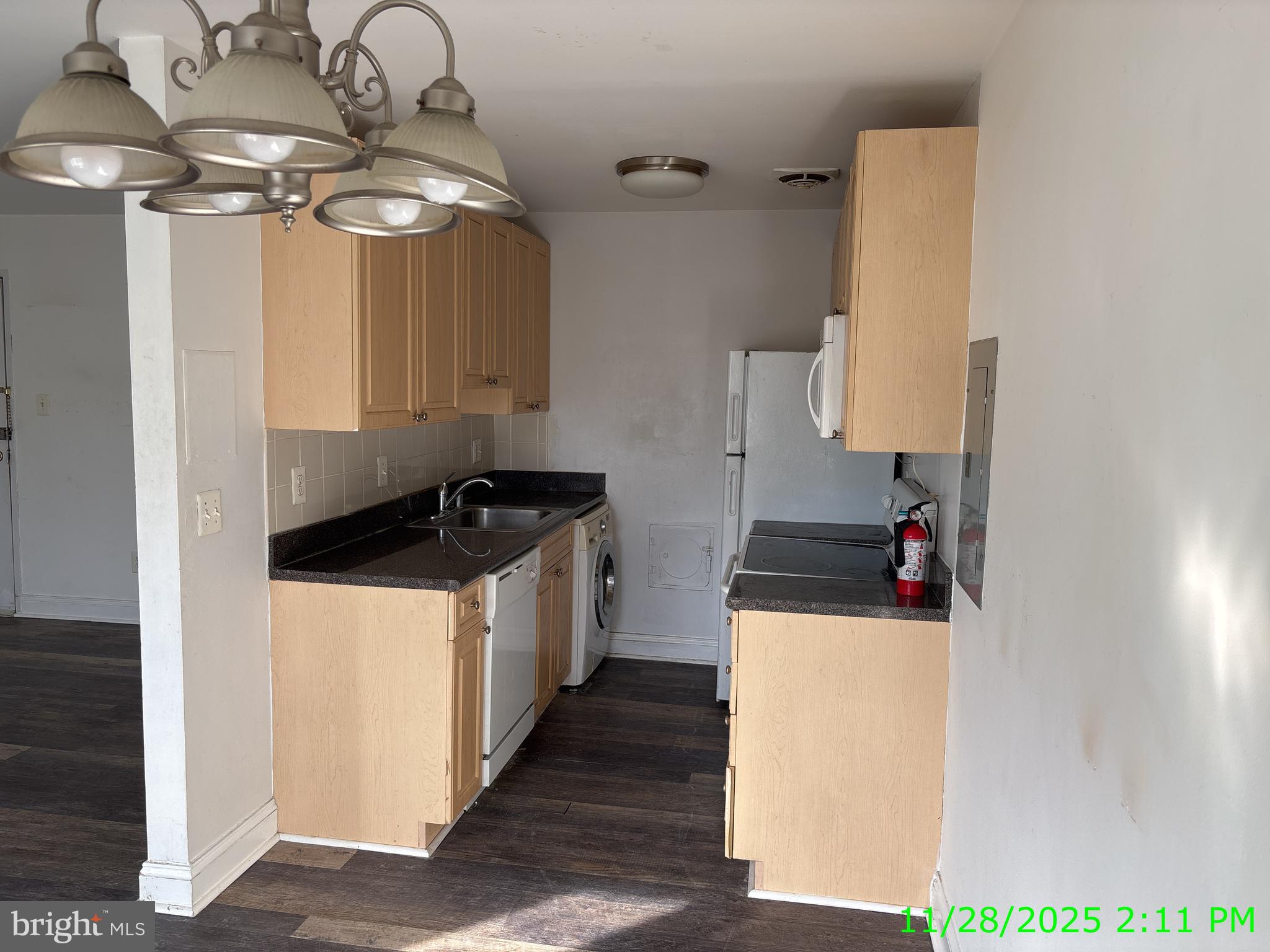 1005 Chillum Road, Unit 319 Hyattsville, MD 20782 - Photo 3 of 5 a kitchen with a sink a stove and cabinets