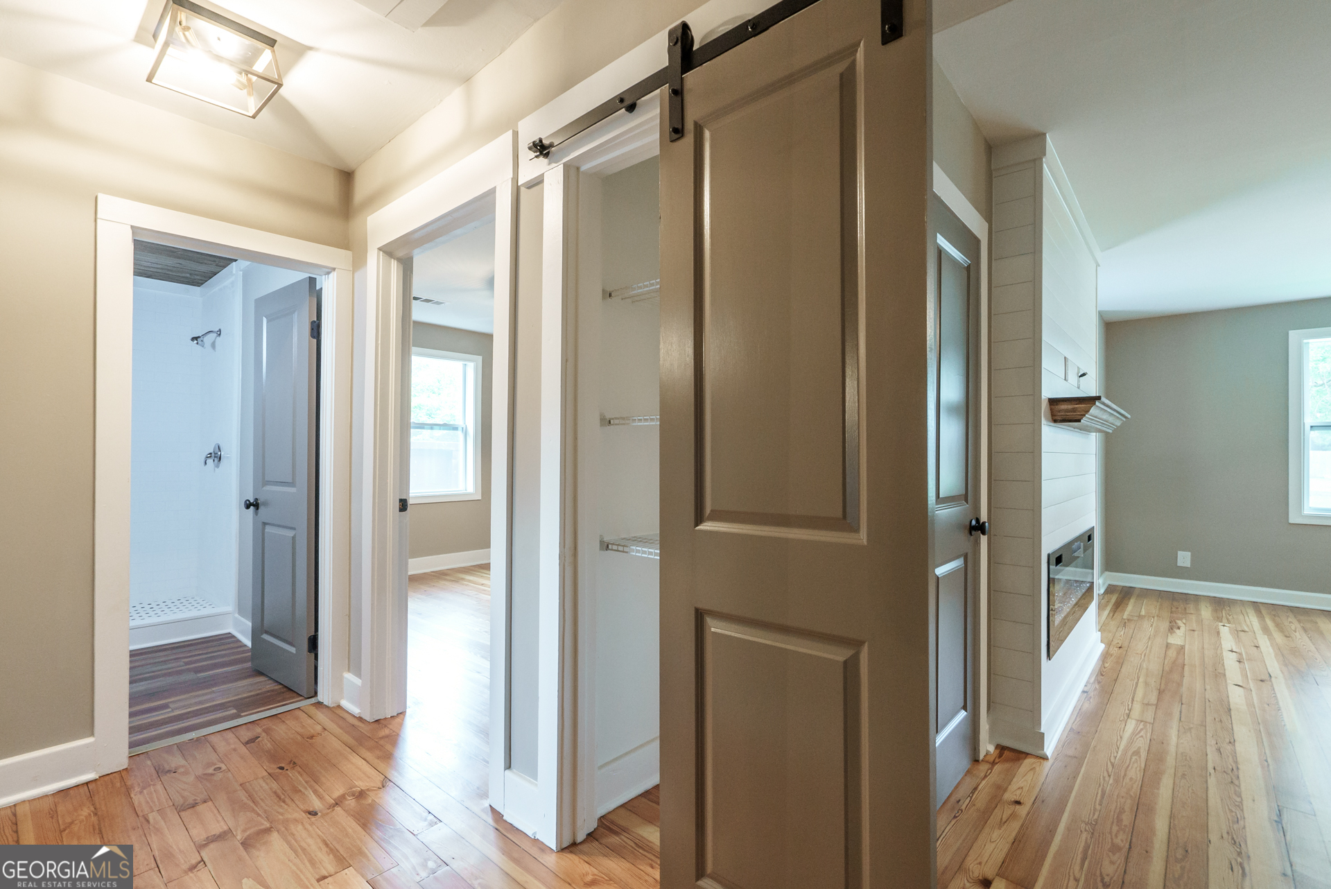175 East Main Street, Unit B Rutledge, GA 30663 - Photo 23 of 28 a view of a hallway with wooden floor and glass door